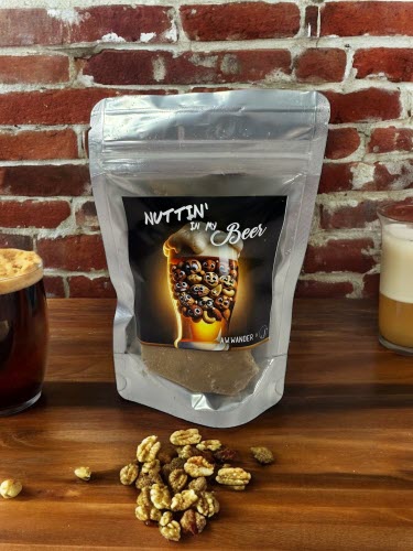 Nuttin In My Beer Brittle Bag on counter with nuts and beer glass